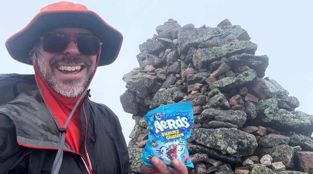 Benj atop Katahdin with Nerds Gummy Clusters